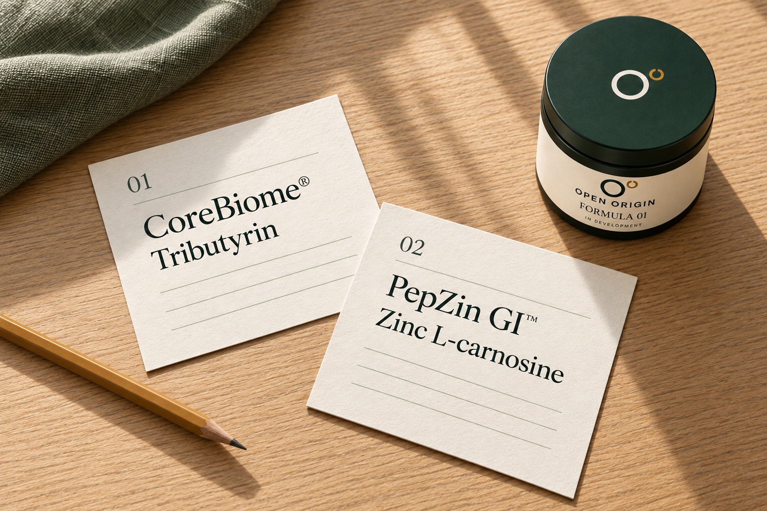 Printed reference cards identify CoreBiome as tributyrin and PepZin GI as zinc L-carnosine, beside the branded jar cap.